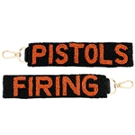 PISTOLS FIRING WRISTLET